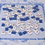 Close-up of mahjong tiles with joker and dragon tiles
